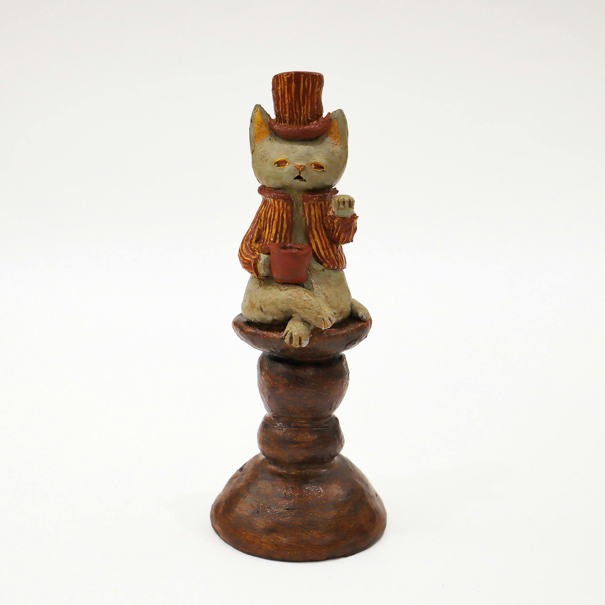 コーヒー片手に招く猫