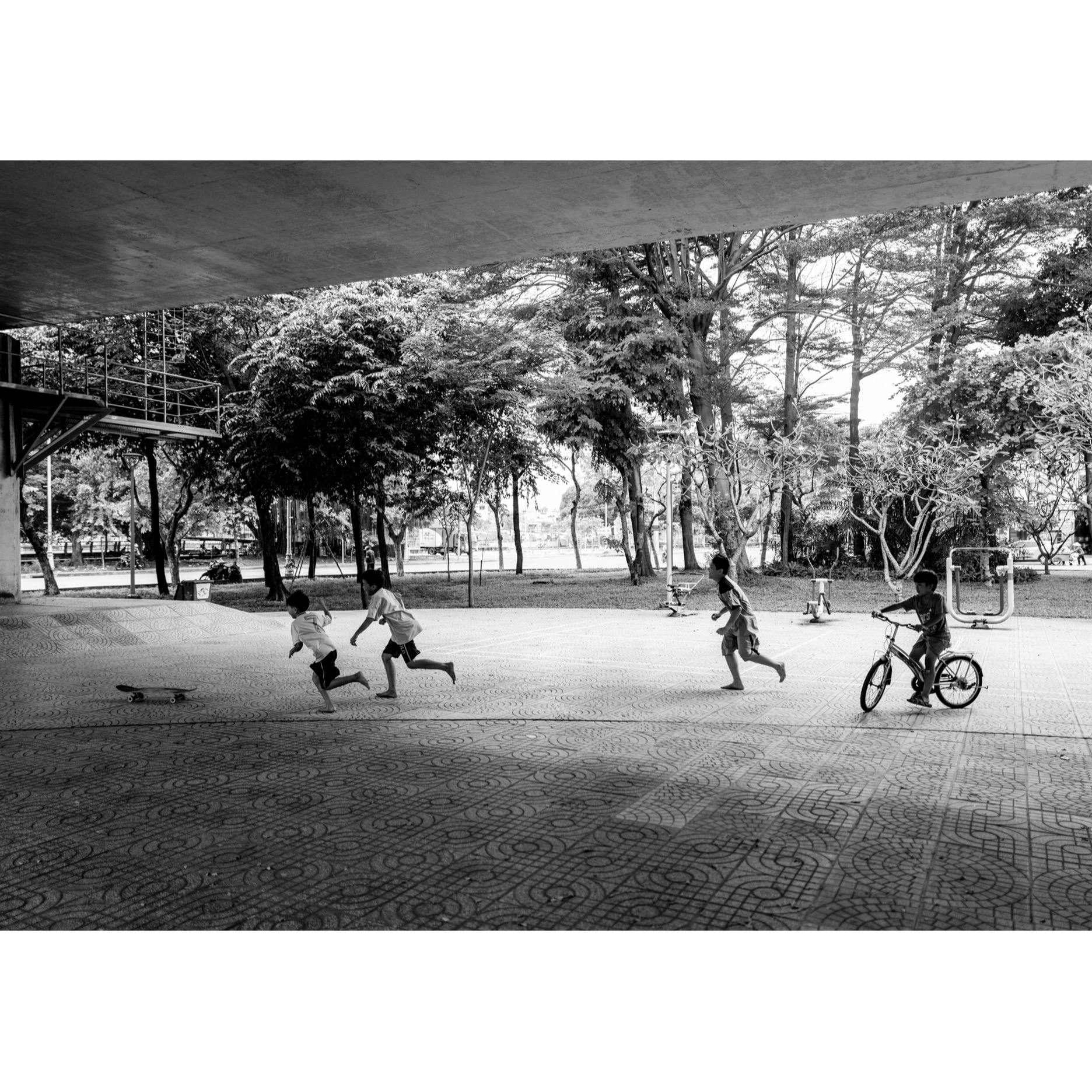 Children Chasing a Skateboard