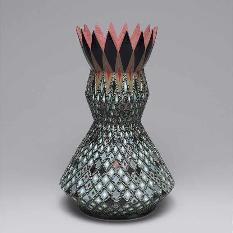 象嵌彩色縄目緑釉壺