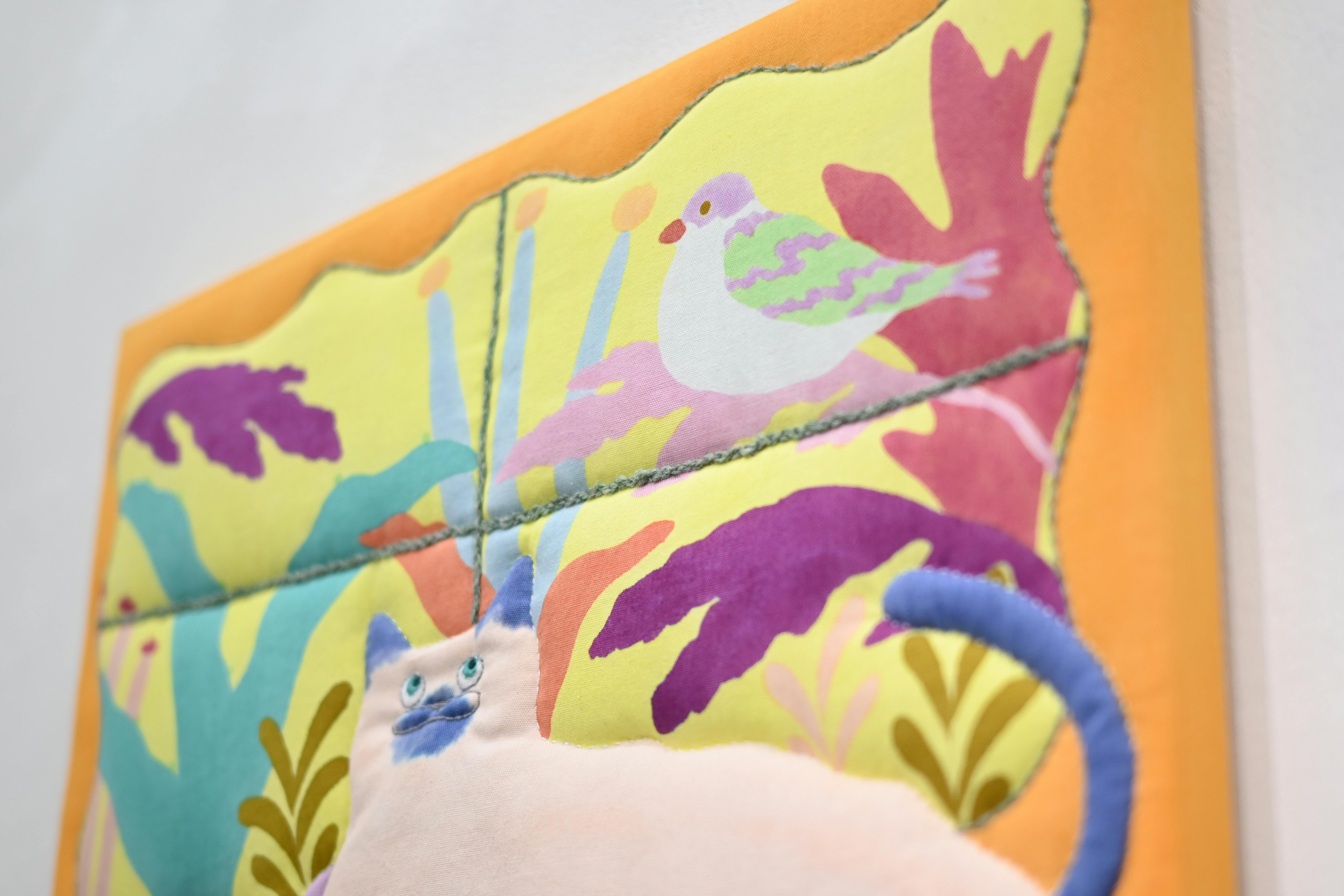 窓の外が気になる猫