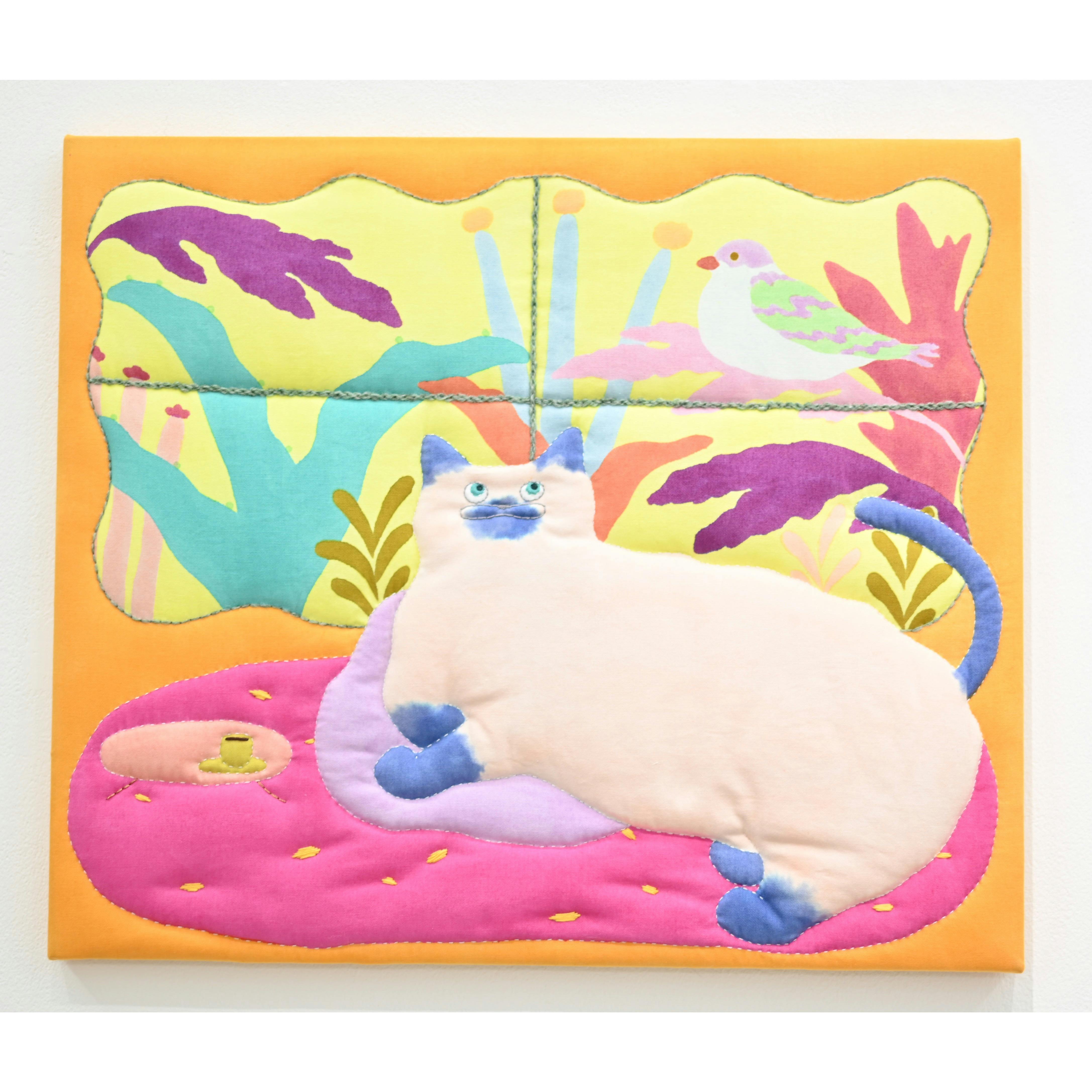 窓の外が気になる猫