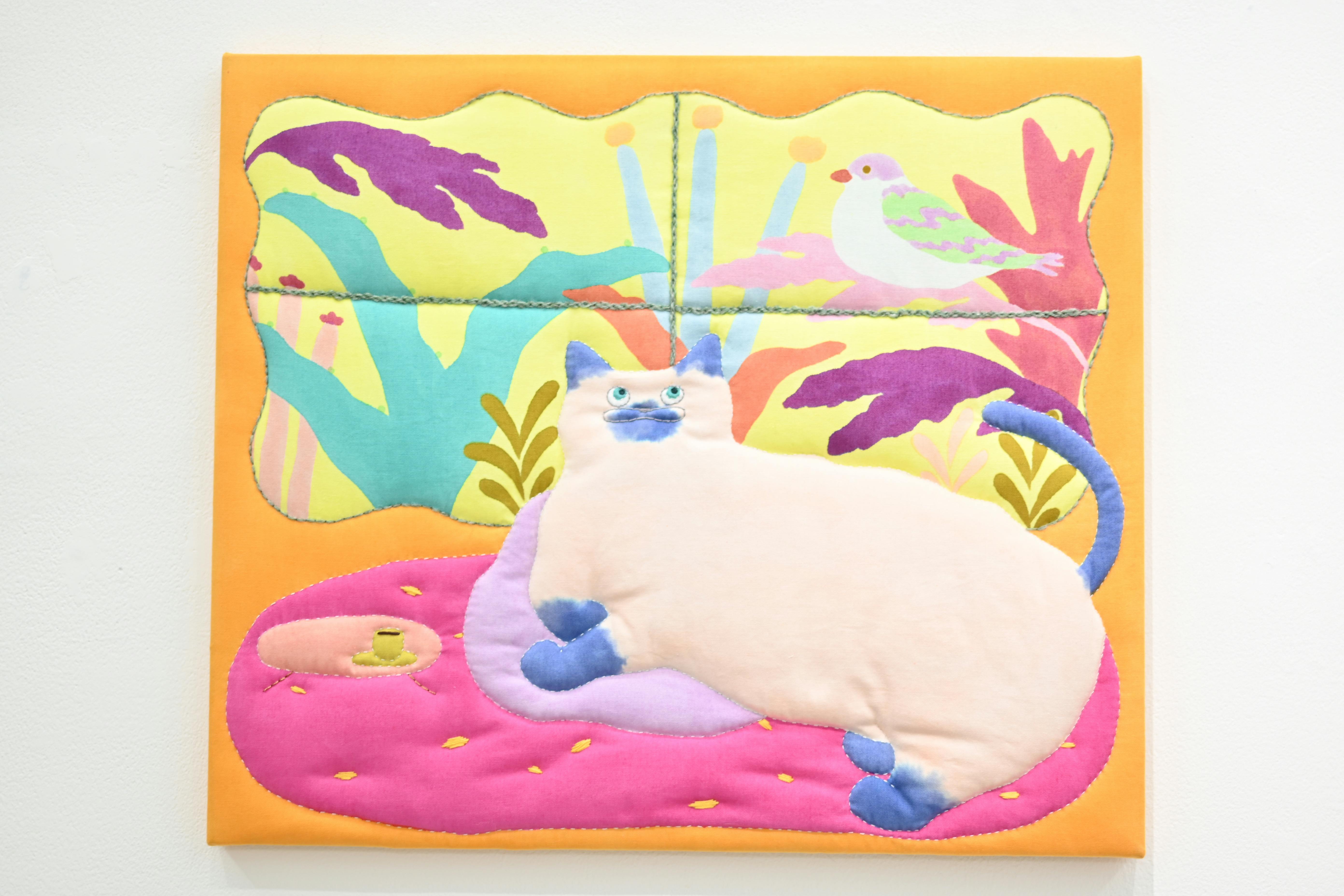 窓の外が気になる猫